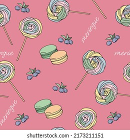 Multicolored meringue cakes on a stick, blueberry sprigs and flowers seamless pattern