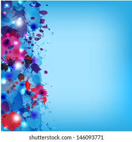 multicolored paint spots on a blue background
