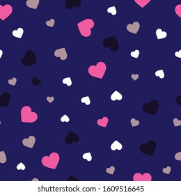 multicolored scattered hearts of different sizes and colors. pink, white, dark, gray. seamless pattern on a dark blue background.