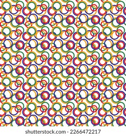 Multicolored seamless pattern on a white background. Rings of blue, green, red and orange colors. Bright background. Wrapping paper for gifts