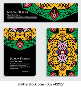 multicolored set of business card and header templates with hand drawn tribal ornament over black background, mandala, for greeting, invitation card, or cover. Vector illustration
