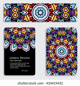 multicolored set of business card and header templates with hand drawn tribal ornament over black background, mandala, for greeting, invitation card, or cover. Vector illustration