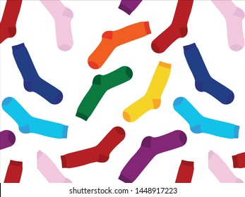 Multi-colored socks on a white background, pattern. View from above. Many different socks for cold seasons. Socks are scattered on a bright background. 