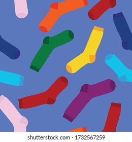 Calcetines multicolores sobre un fondo blanco sin fisuras. Vista desde arriba. Muchos calcetines diferentes para las estaciones frías. Los calcetines están esparcidos en un fondo brillante. 