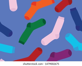 Multi-colored socks on a yellow background. View from above. Many different socks for cold seasons. Socks are scattered on a bright background. 