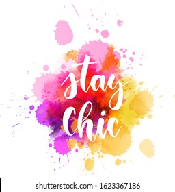 Multicolored splash watercolor blot with handwritten modern calligraphy text "Stay chic". Multicolored. Inspirational calligraphy lettering text. 