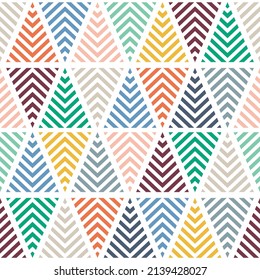 Multicolored striped triangles. Abstract geometric seamless pattern. Modern texture. Colorful geometric background