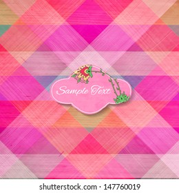 Multicolored triangular cloth texture background with paper floral label. Vector illustration