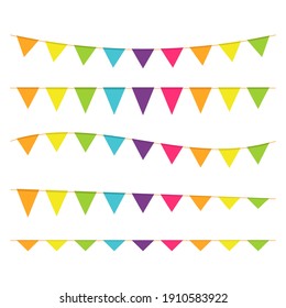 Multicolored triangular flags on ropes on a white background. Decoration from triangular flags.