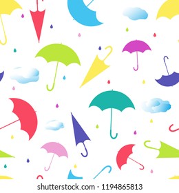 Multicolored umbrellas with clouds and raindrops. Seamless vector.