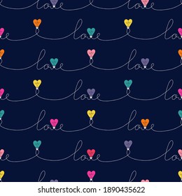 Multi-Colored Valentine's Day Holiday Intertwined Heart Shape String Lights And Calligraphic Word Love Vector Seamless Pattern on Dark Background. Rainbow Festive Love Background