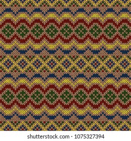 Multicolour ethnic motley background in red, yellow, green, beige and blue colours, seamless knitting vector pattern as a fabric texture