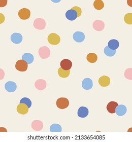 Multicoloured childish confetti spotted vector seamless pattern. Infantile dotted gender neutral colours background. Kid-like mottled surface design for fabric or Scandinavian style nursery.