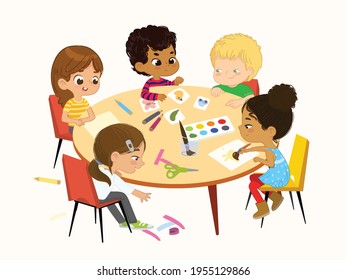 Multicultural, multi aged boys and girls sit at a round table playing games, make applique and painting. Kids draw pictures with paints and pencils. Creative children. Isolated