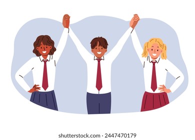 Multiethnic children raise hands in unison, rejoicing at absence of racial discrimination in receiving primary education. Happy junior school students celebrate joint victory in education olympiad