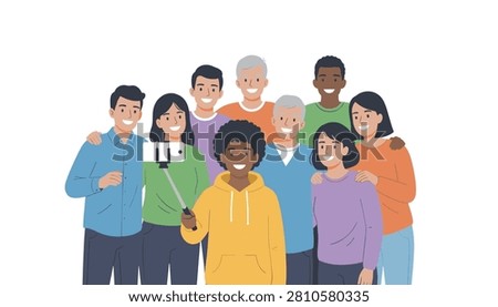 Multiethnic group of people smiling and huddling together while taking a group selfie with an extendable stick in studio.