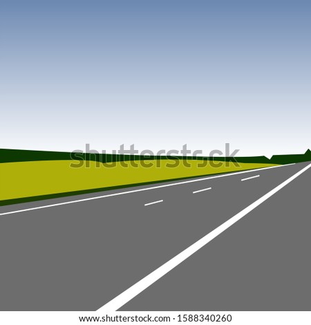 A multi-lane asphalt road in the middle of green fields.