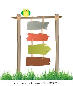 Multiple colorful sign boards hanging on the post with an owl 