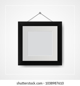 Multiple many small picture and photo frames on white wall