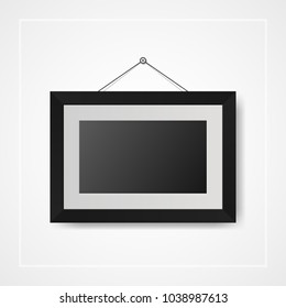 Multiple many small picture and photo frames on white wall
