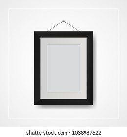 Multiple many small picture and photo frames on white wall