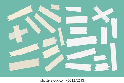 Multiple pieces of colorful and grey sticky tape in different shapes on green background.