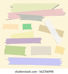 Multiple pieces of colorful sticky tape in different shapes on light beige  background