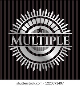 Multiple silver badge or emblem