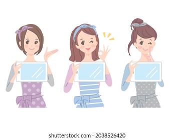 Multiple young women explaining while looking at the tablet screen