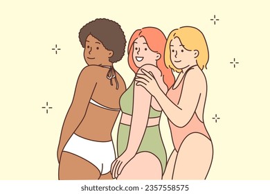 Multiracial friendly women in bikinis smile and demonstrate absence of prejudice and discrimination. Multiracial girls in swimsuits pose calling for diversity and lack of hate for looks