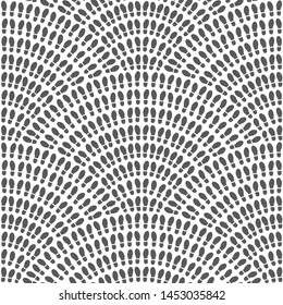 Multitude of dark grey and black shoes foot imprint on a white background. 
Vector abstract seamless wavy pattern with geometrical fish scale layout. Population crowd meeting concept wallpaper print