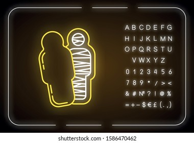 Mummy neon light icon. Pharaoh in sarcophagus. Dead body in coffin. Religion and mythology. Ancient egyptian culture. Glowing sign with alphabet, numbers and symbols. Vector isolated illustration