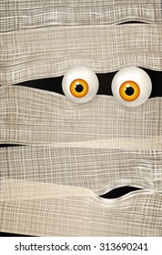 Mummy's big shiny yellow eyes. Funny Halloween background. Can be used for greeting card, invitation, poster, flyer. Vector illustration