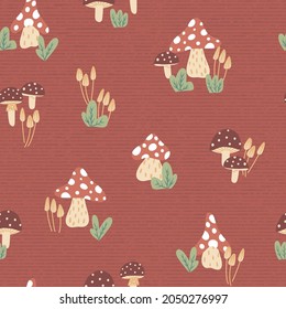 Mushroom drawings in dark red background creating a seamless pattern background print. Vector illustration. Fall kids projects and home decor projects. Autumn surface pattern design.