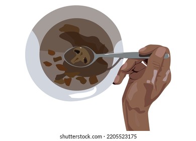 Mushroom soup dish from top view with hand holding spoon with one mosuroom on it and white bowl on white background