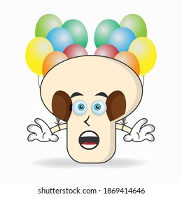 mushrooms mascot character holding a balloon. vector illustration