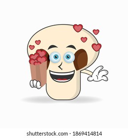 mushrooms mascot character holding a love icon. vector illustration