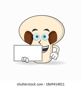 mushrooms mascot character holding a white blackboard. vector illustration