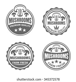 Mushrooms set of four vector round black labels, badges, emblems and stickers for product packaging isolated on white background