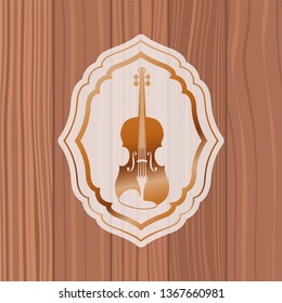 music cello in frame with wooden background