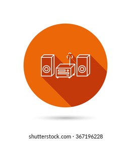 Music center icon. Stereo system sign. Round orange web button with shadow.
