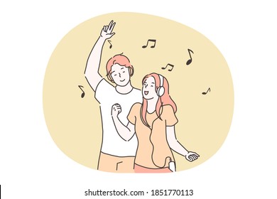 Music, fun, singing, dancing, entertainment concept. Young smiling happy boy and girl teens cartoon characters listening to favourite music in headphones, enjoying and having fun together 