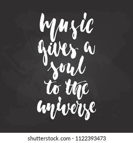 Music gives a soul to the universe - hand drawn Musical lettering phrase isolated on the black chalkboard background. Fun brush chalk vector quote for banners, poster design, photo overlays.