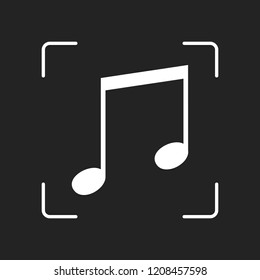 Music note icon. White object in camera autofocus on dark background