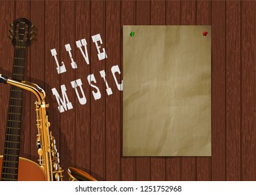 Musical background live music with wooden boards, acoustic guitar, saxophone and a piece of paper for an inscription or image.