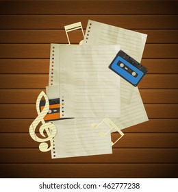 Musical background paper treble clef with music notes, audio cassettes and blank paper pages on wooden boards. There is a place to put any text or image.