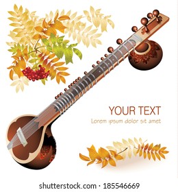 Musical background series. Traditional Asian sitar, isolated on white autumn background with yellow leaves and a bunch of rowan 