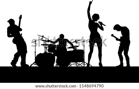 A musical group or rock band playing a concert in silhouette