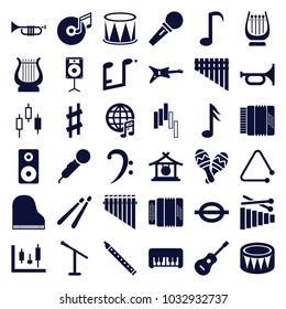Musical icons. set of 36 editable filled musical icons such as gong, piano toy, trumpet, microphone, guitar, panel control, control panel, bass clef, music note, harmonica