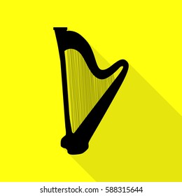 Musical instrument harp sign. Black icon with flat style shadow path on yellow background.